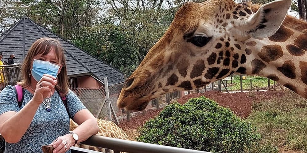 Lesley Feeding Giraffes in Kenya